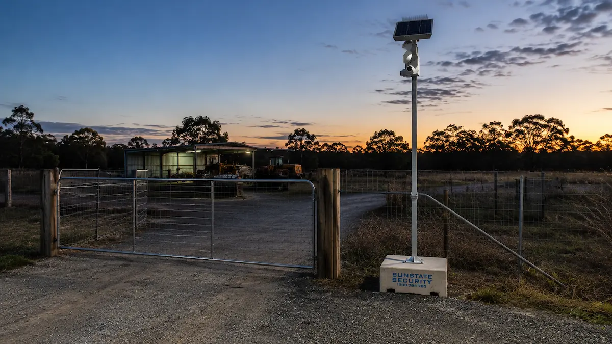 Solar powered surveillance camera protecting a rural gate farm shed or remote property